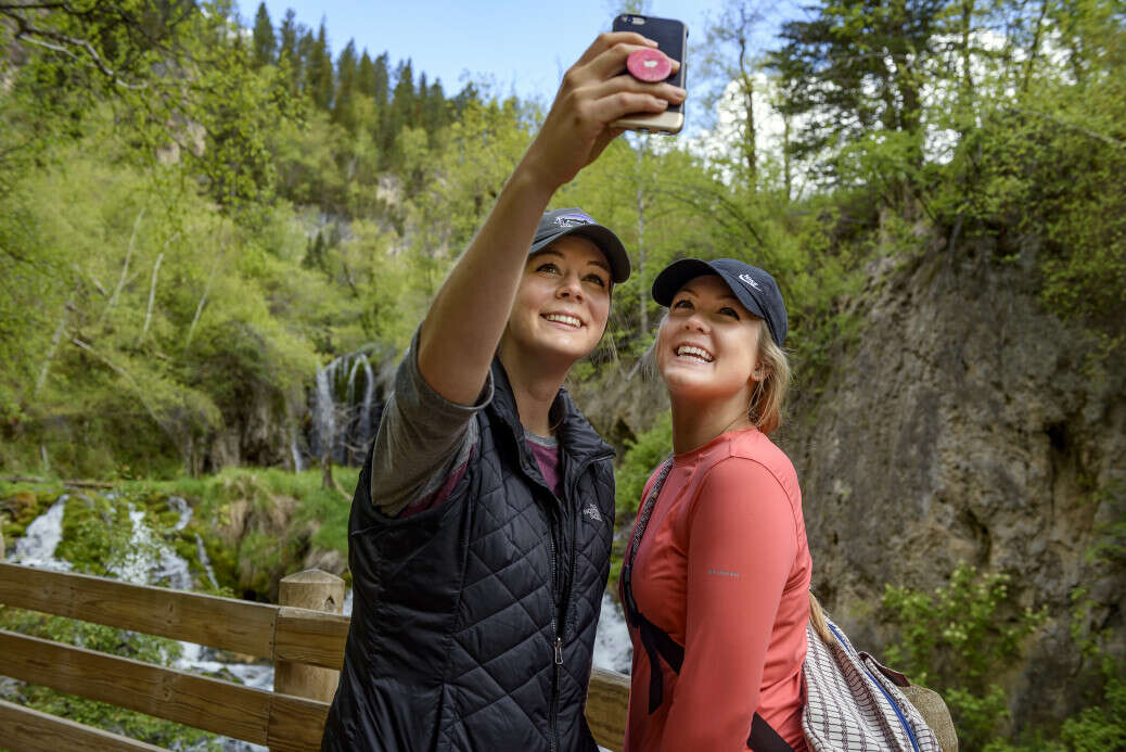 Visitors in front of Roughlock Falls