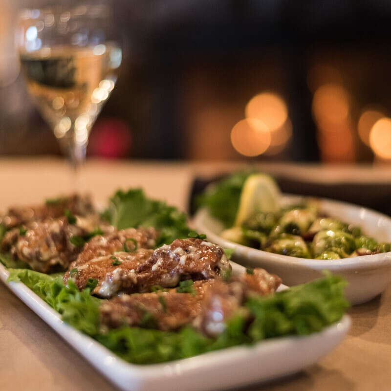 Closeup of Food and a Glass of White Wine