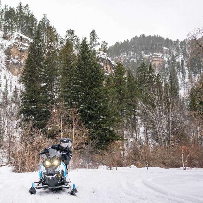Snowmobiling in Spearfish Canyon