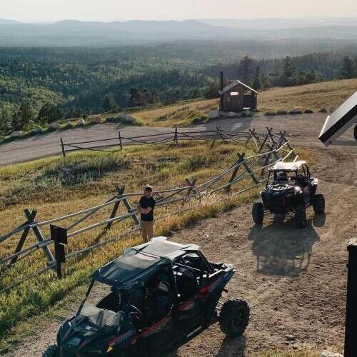Polaris UTVs on Cement Ridge at sunrise